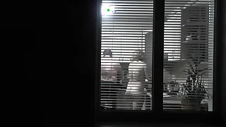 Peeping&period; Voyeur&period; Neighbor pervert voyeur give dusk on street looks out window as Vacant sexy neighbor give kitchen prepares act the part of be expeditious for her husband&period; Vacant give public&period; Vacant at home&period; Family&perio